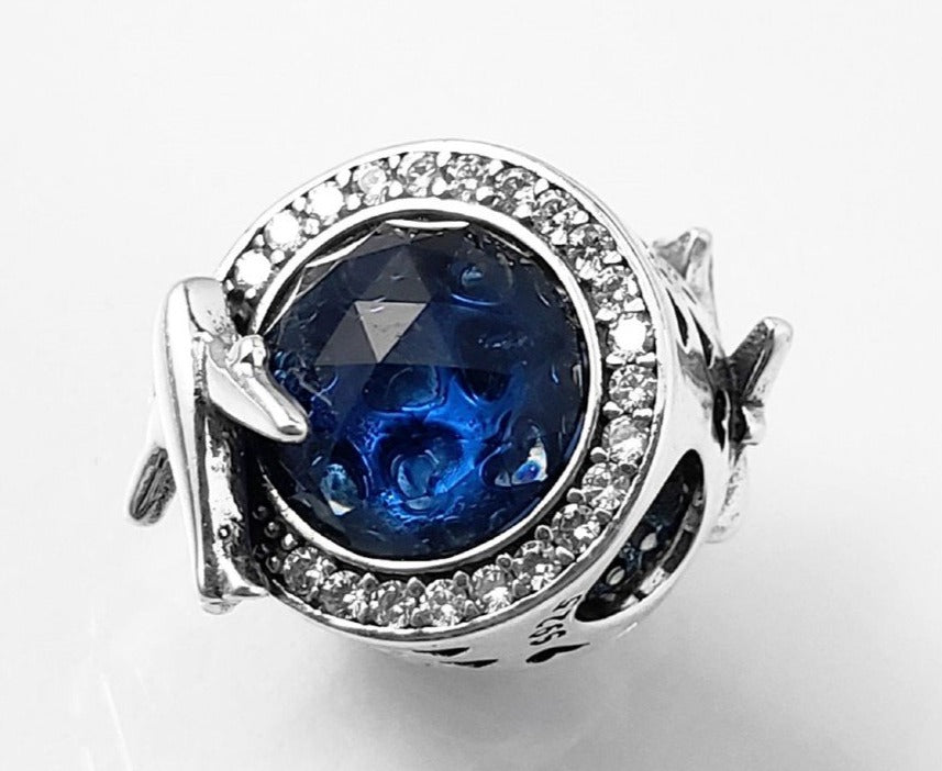 PCHARM2310 PIEDRA AZUL CON CIRCONES TRANSPARENTE AL REDEDOR