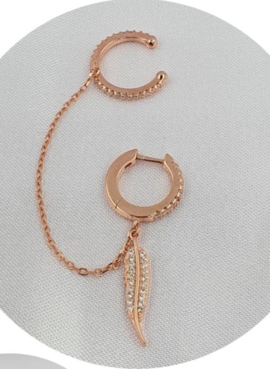 PIERCING TREPADOR EN FORMA DE PLUMA COLOR ROSADO DE PLATA 9.25 PESO: 3.3G