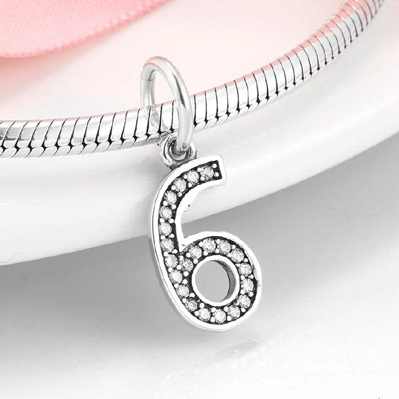 PCHARM4065$6 NUMERO 6 PANDORA PLATA 9.25