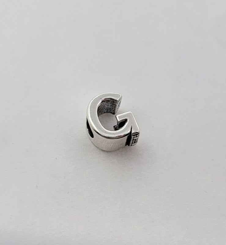 PCHARM787$G LETRA G PANDORA PLATA 9.25